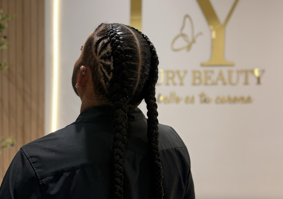 Boxer braids with designs on the sides with added hair