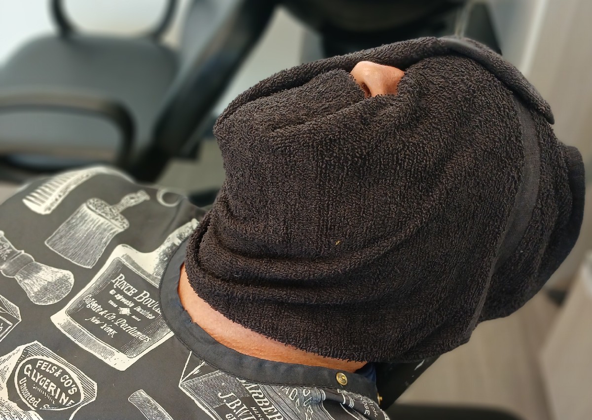 Beard trim with razor and hot towels