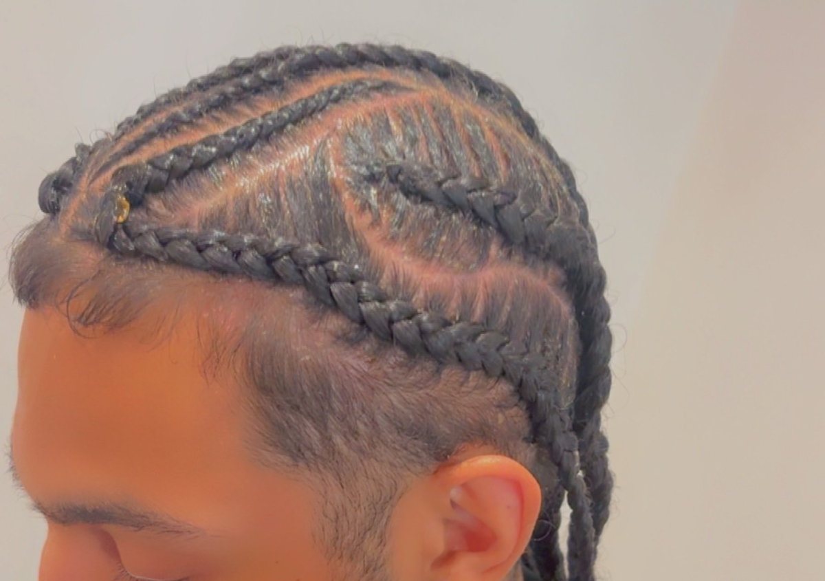 Men stitch braids